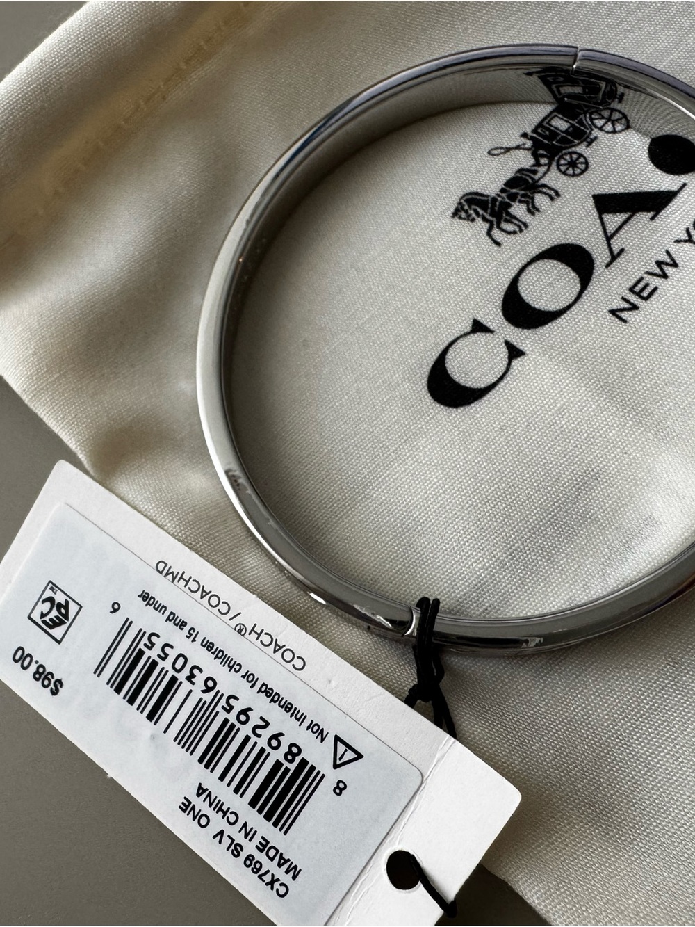 Coach Silver-Tone Signature Bangle Bracelet - Picture 2 of 9